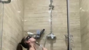 brunette with big breasts washes in the shower