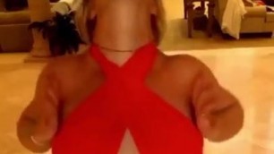 Britney Spears in red top and black bottoms