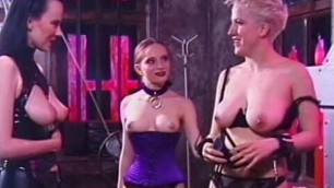 Bitches in latex engage in BDSM in dungeon