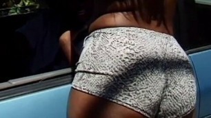 Black hooker girl wearing slutty clothes sucks an ebony cock
