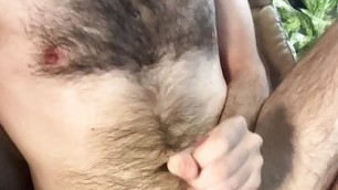 Skinny white guy shows off very hairy torso and jerks off in a spinning chair